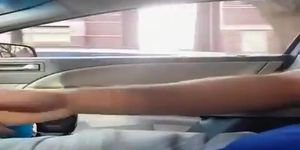 Guy plays with his cock inside car