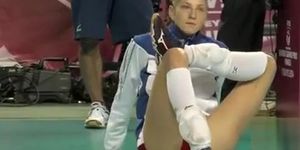 Leggy volleyball girl stretches before a match