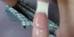 Two guys cum in one condom