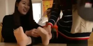 Two Chinese girls revenge tickle their teacher