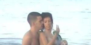 Young attractive couple fucks in the sea