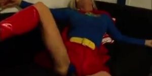 a girl undressing supergirl & dressing as her