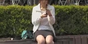 Japanese girl sending text messages as she gets involved in sharking attack