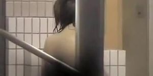 Asian hottie is pouring body with water on shower spy cam