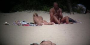 Hot couple caught on a nude beach spy cam vid