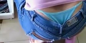 Whale tail peeks out of her trousers