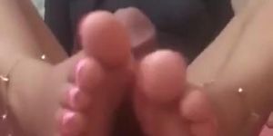 Asian Girl gives Footjob and Takes Cum