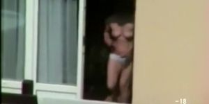 Voyeuring thru window neighbor in nothing but panty