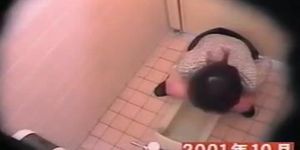 Masturbating Asian girl in the college toilet