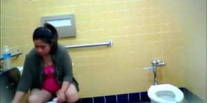 Curvy mommy urinates in the public WC