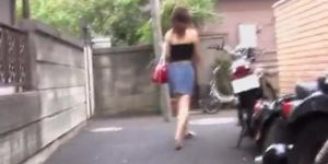 Busty Japanese girl spied on while walking home