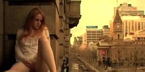 Ginger girl masturbates in public outside her apartment