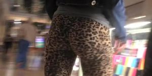 Teen in leopard leggings at the shopping mall