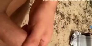 Stroking as ladies hang out on the beach (Uncut Dick)