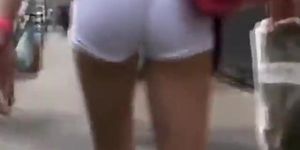 Sexy shorts tucked far up her butt crack