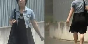 Black-haired skinny Asian hoe flashes her bushy pussy during street sharking