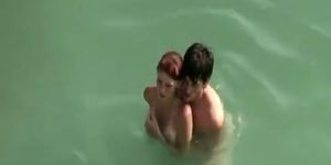 Young couple fucks in the water