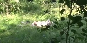 Naturist couple caught fucking in grass