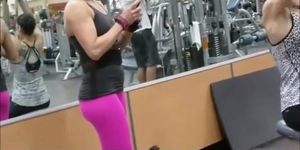 Fit woman wearing tight pink sports pants