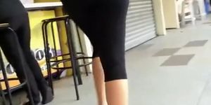 Nerd teen in black leggings walking