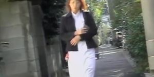 Skirt sharking of an attractive red haired Asian chick