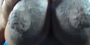 Latina ebony plays and sucks her huge nipples