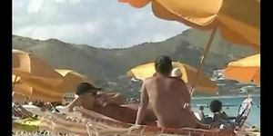 Beach voyeur video of a nude milf and a nude Asian hottie (Full Frontal)