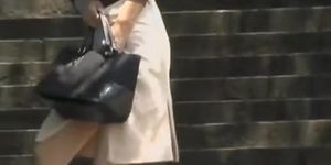 Business Asian lady got skirt sharked on her way to work
