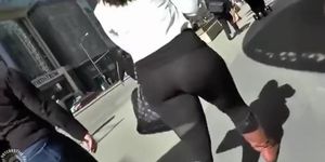 Big butt woman walks the city streets in spandex