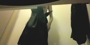 Sexy girl tries skirts in a fitting room