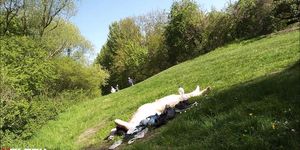 A man sunbathes completely naked in a park in  ...