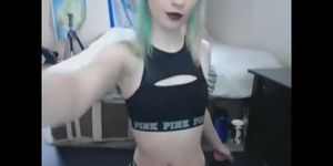 Colored hair slut performing fetish on WebCam
