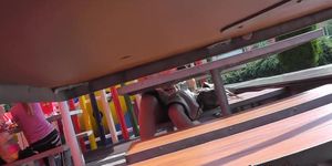 Sexy sitting upskirt in a street cafe