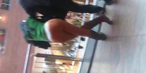 Girl in thong in a shopping mall