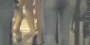 Sexy asses in jeans are filmed on a night out