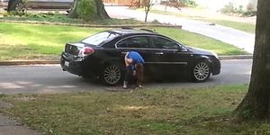 Girl caught on voyeur cam pissing on the car wheel