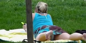Voyeur spied her relaxing on the grass