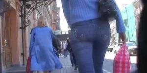 Candid street voyeur enjoys filming tight booties.