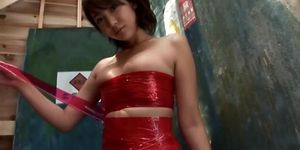 Asian girl in clean red plastic tape