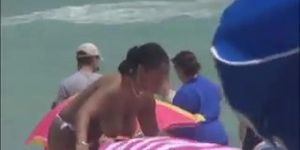 Plump breasted girl caught in a voyeur beach nudism video