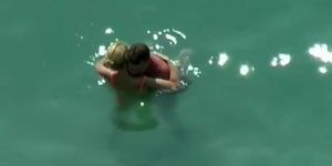 Couple kissing and fucking in the water