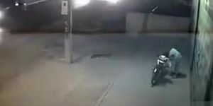 Female motorcyclist gets caught on security cam urinating