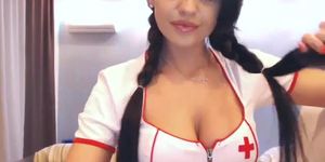 Cute brunette girl in nurse uniform