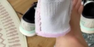 latina taking off shoes and socks