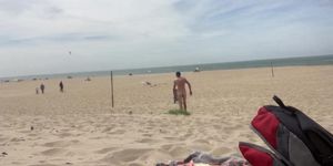 Dildo anal insertion on public beach