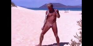 Beach Striptease: Tanned Hunk Bares All