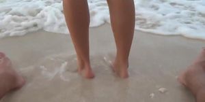 Sandy Footjob at the beach