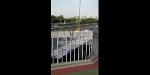 Chinese naked walking on bridge