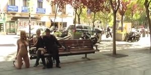 Naked blonde kneeling in public streets
