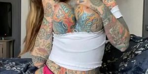 Tattooed bitch spreads her pussy for you